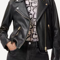 Women’s black leather moto jacket in a tailored modern fit.
