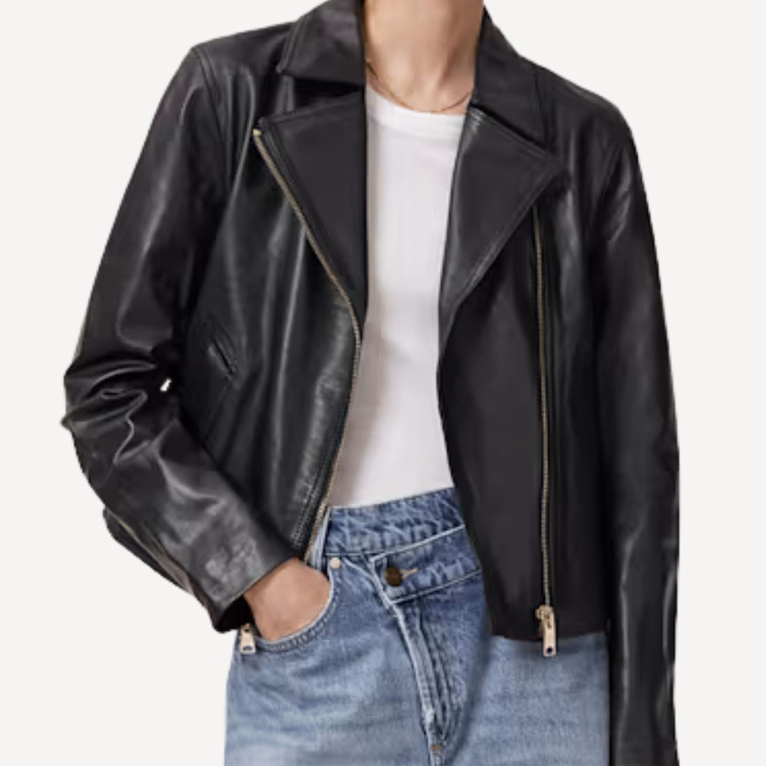 Black cropped leather jacket featuring tailored silhouette.