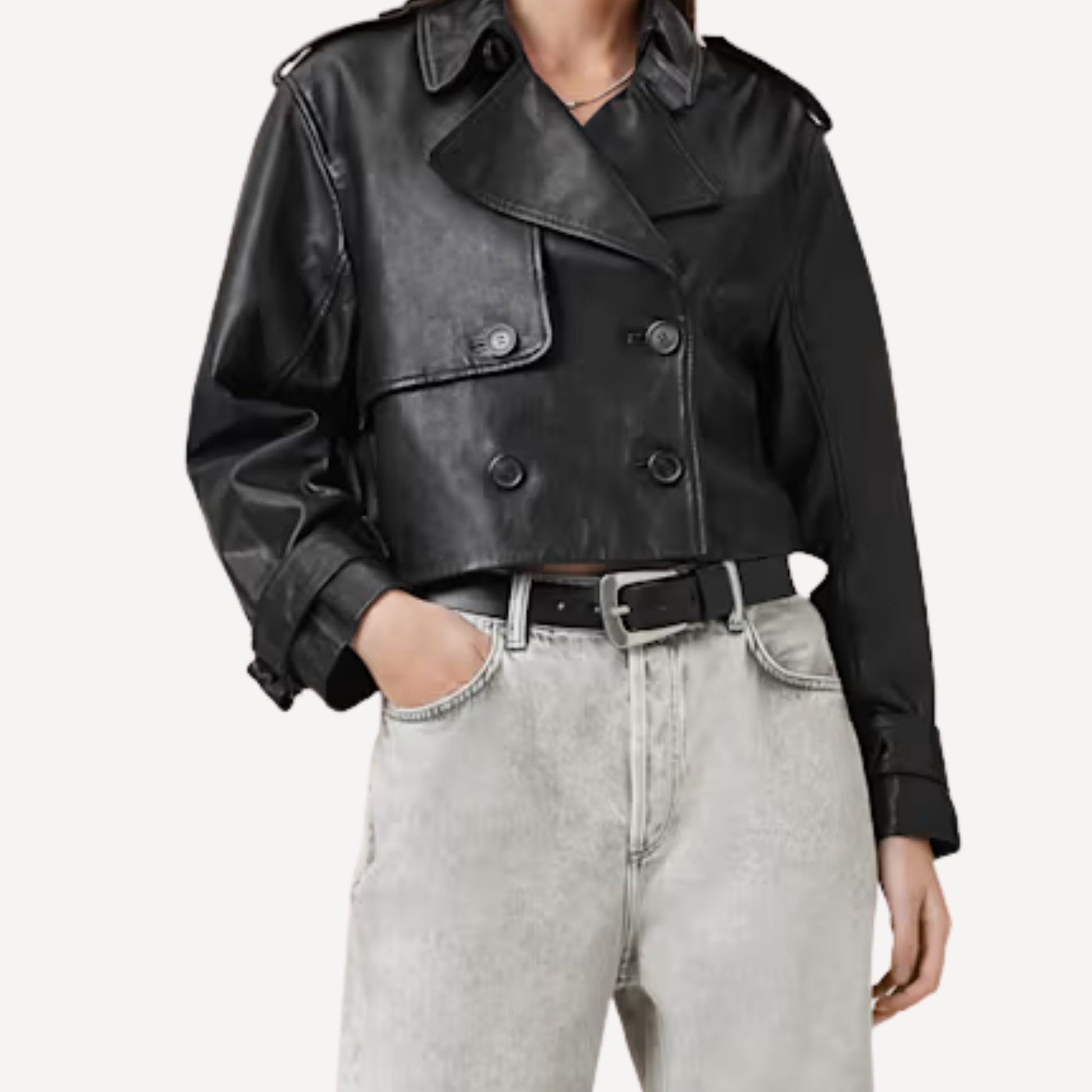 Front view of women's cropped black leather trench coat with modern fit
