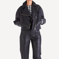 Interior view of women's oversized leather biker jacket, showcasing soft lining and craftsmanship