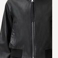 Ladies black leather bomber jacket for fashion and street style.