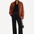 Stylish women’s brown leather jacket in vintage finish and oversized cut
