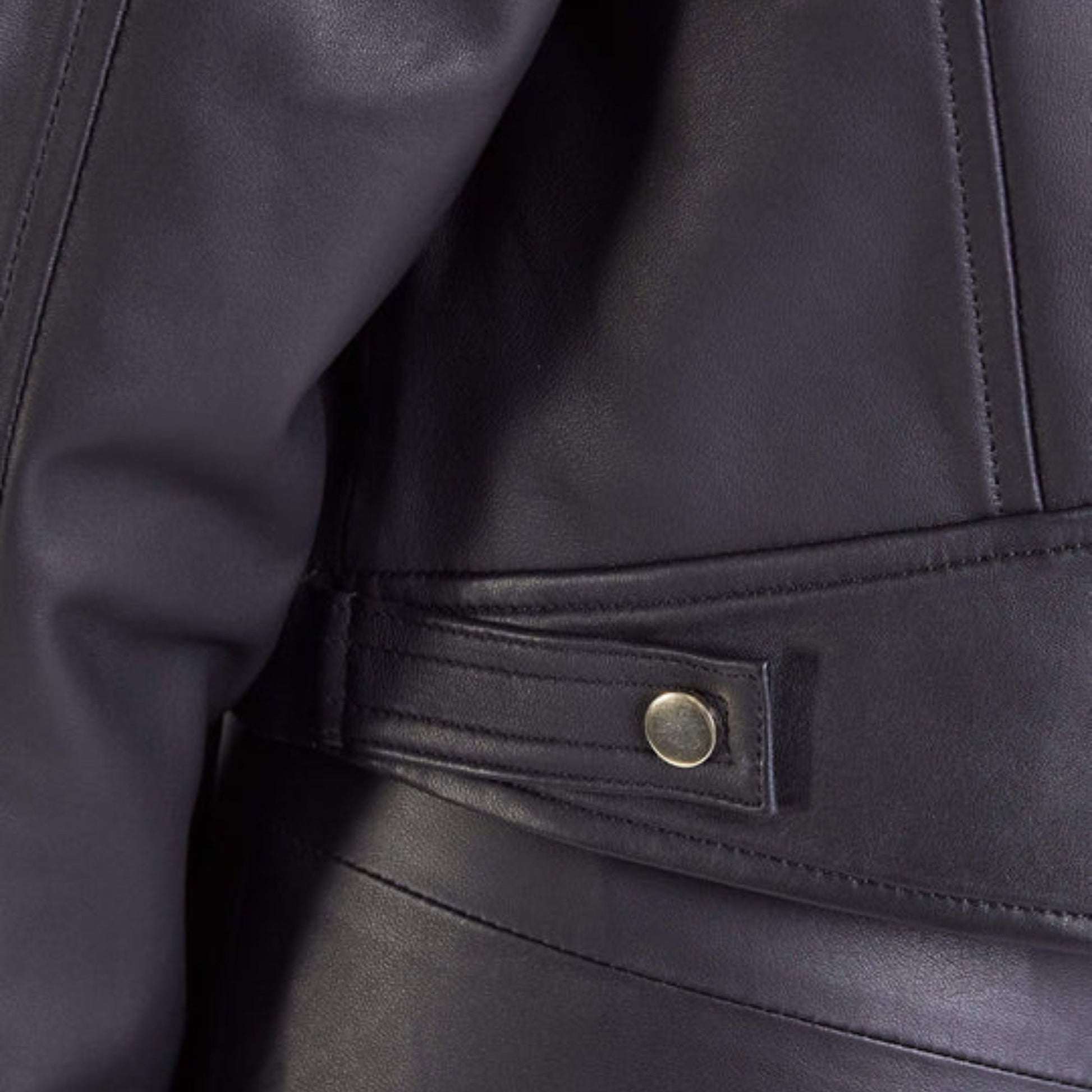 women's oversized leather biker jacket, showing seam details and relaxed fit