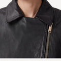 Stylish cropped leather trench jacket for modern outfits.